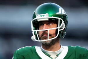 EAST RUTHERFORD, NEW JERSEY - JANUARY 05: Aaron Rodgers #8 of the New York Jets looks on before the game against the Miami Dolphins at MetLife Stadium on January 05, 2025 in East Rutherford, New Jersey.