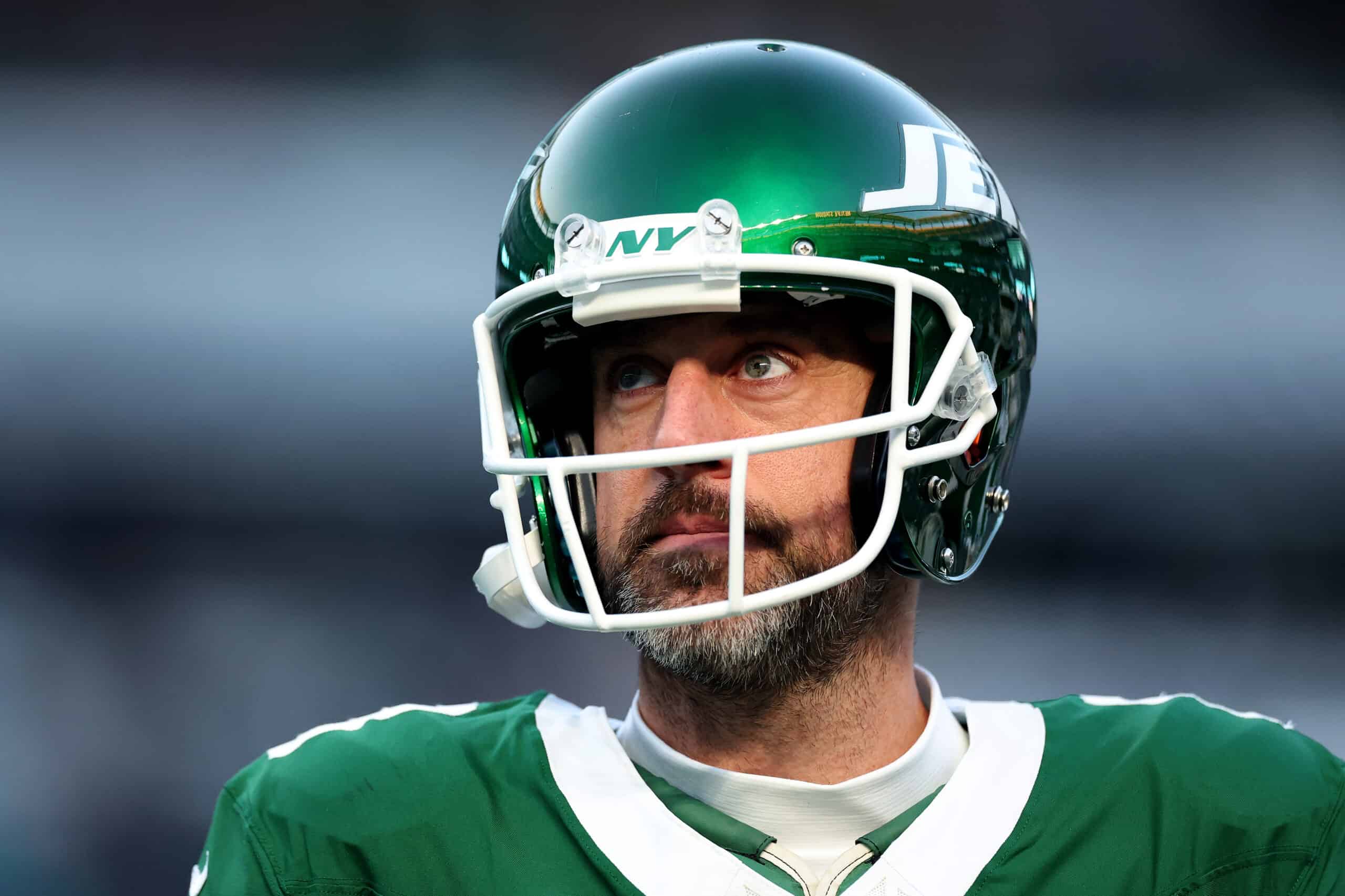 EAST RUTHERFORD, NEW JERSEY - JANUARY 05: Aaron Rodgers #8 of the New York Jets looks on before the game against the Miami Dolphins at MetLife Stadium on January 05, 2025 in East Rutherford, New Jersey.
