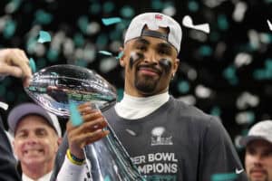 NEW ORLEANS, LOUISIANA - FEBRUARY 09: Jalen Hurts #1 of the Philadelphia Eagles celebrates with the Vince Lombardi Trophy after defeating the Kansas City Chiefs 40-22 to win Super Bowl LIX at Caesars Superdome on February 09, 2025 in New Orleans, Louisiana.