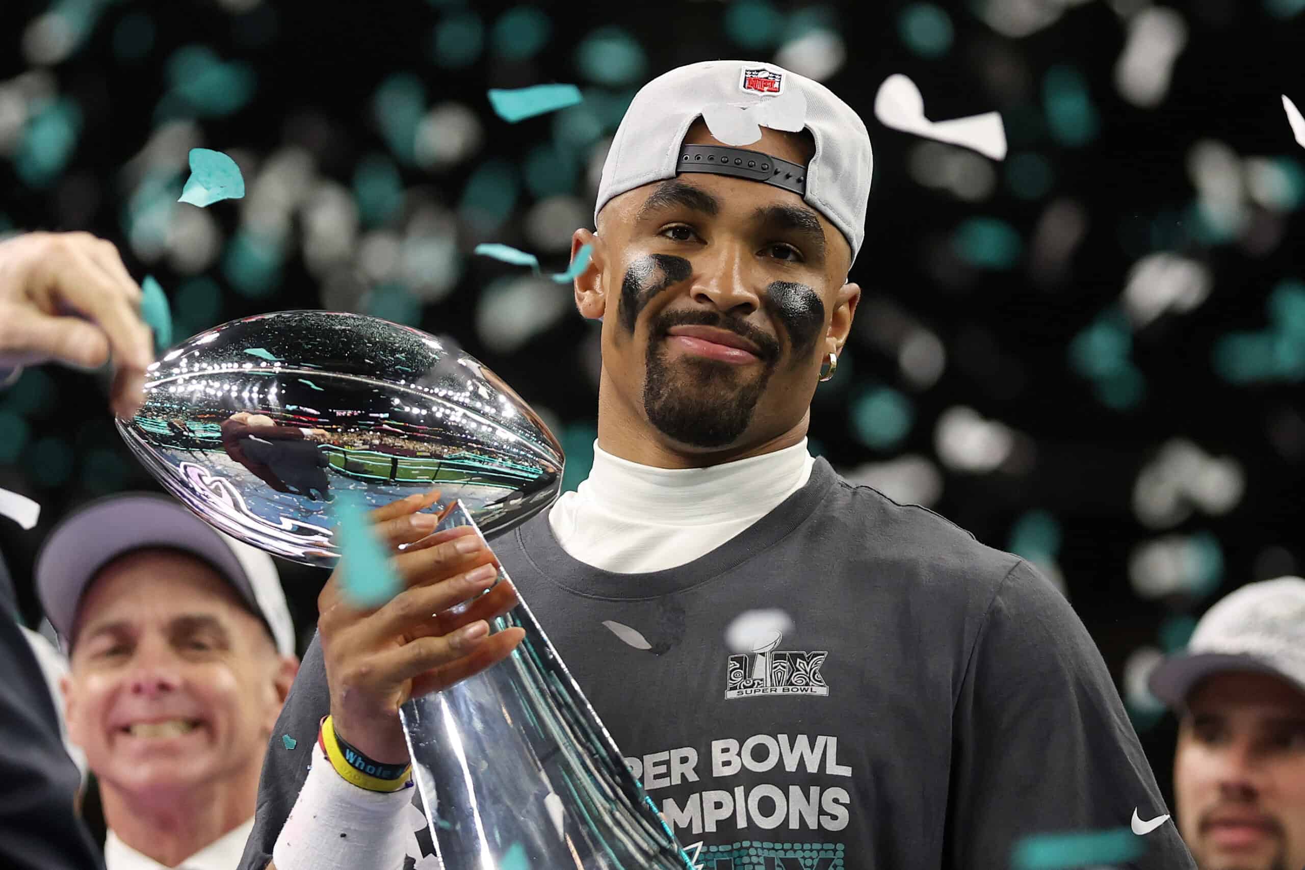 NEW ORLEANS, LOUISIANA - FEBRUARY 09: Jalen Hurts #1 of the Philadelphia Eagles celebrates with the Vince Lombardi Trophy after defeating the Kansas City Chiefs 40-22 to win Super Bowl LIX at Caesars Superdome on February 09, 2025 in New Orleans, Louisiana.