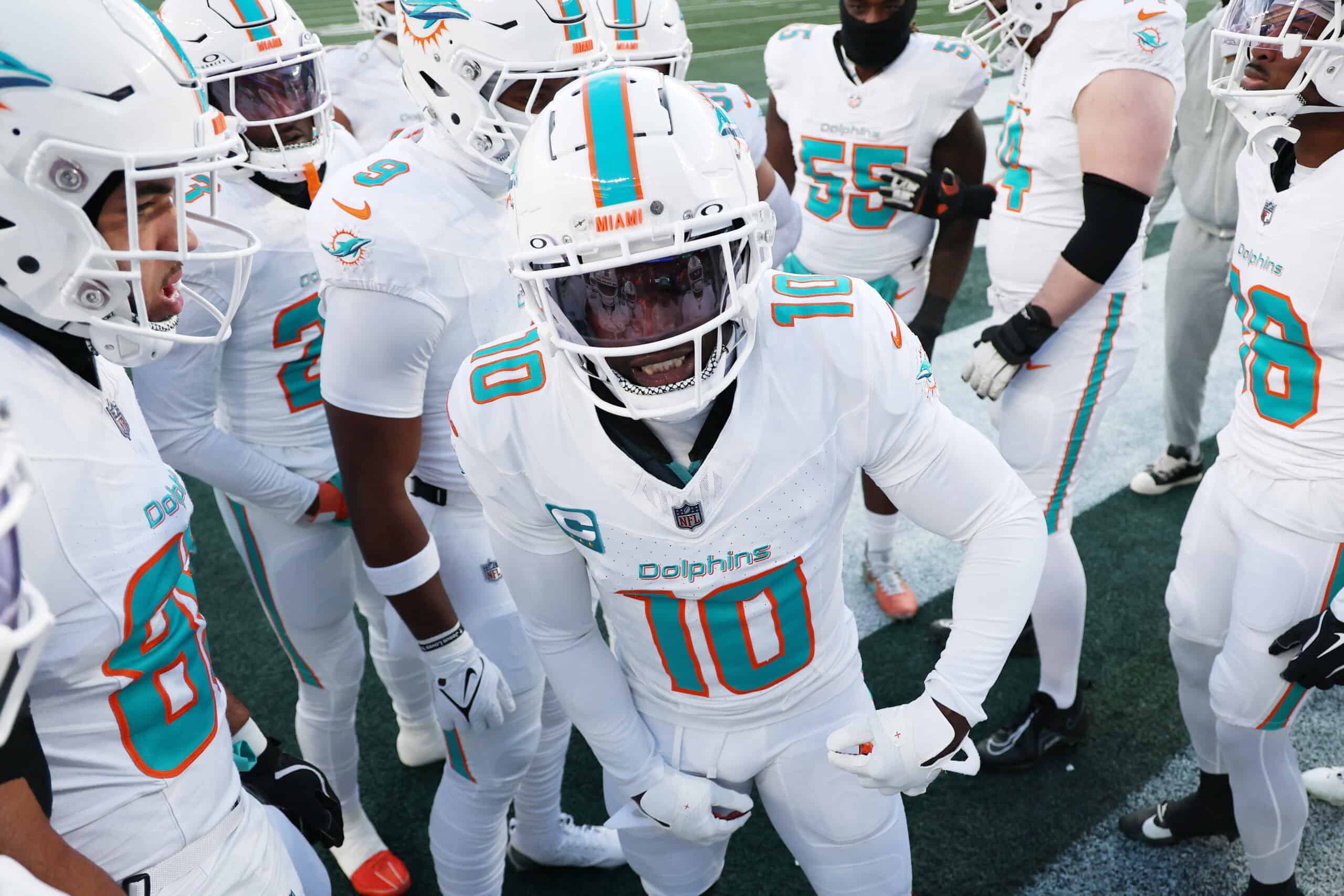 EAST RUTHERFORD, NEW JERSEY - JANUARY 05: Tyreek Hill #10 of the Miami Dolphins in a team huddle before the game against the New York Jets at MetLife Stadium on January 05, 2025 in East Rutherford, New Jersey.