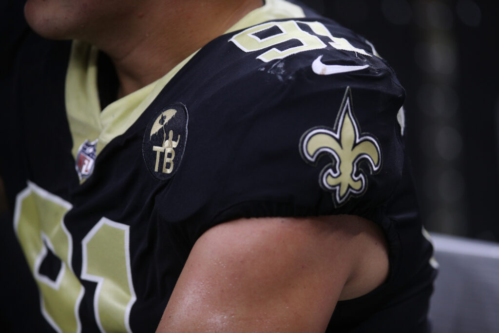 NEW ORLEANS, LA - AUGUST 17: A logo for former team owner Tom Benson is seen on the uniforms of the New Orleans Saints at Mercedes-Benz Superdome on August 17, 2018 in New Orleans, Louisiana.