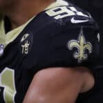 NEW ORLEANS, LA - AUGUST 17: A logo for former team owner Tom Benson is seen on the uniforms of the New Orleans Saints at Mercedes-Benz Superdome on August 17, 2018 in New Orleans, Louisiana.